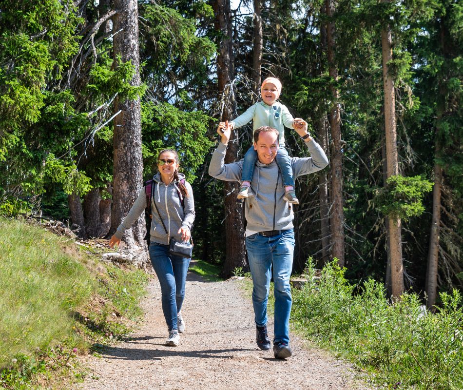 Family hiking down a path