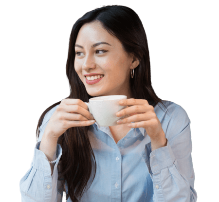 Woman in blue shirt holding coffee cup