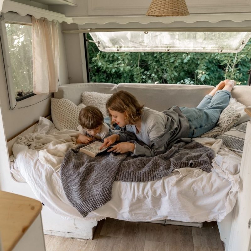 Mother and child relaxing within their tiny home